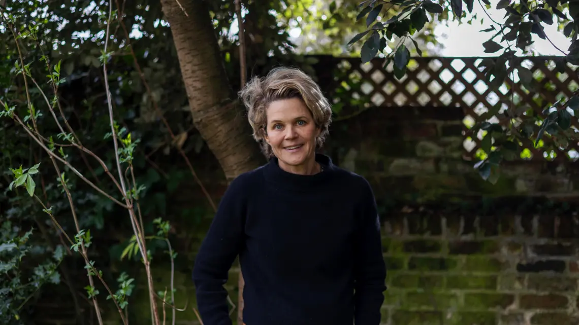 Griswold,-Eliza-(c)-Seamus-Murphy-(Circle-of-Hope).gif Portrait of Author Eliza Griswold standing in front of greenery.