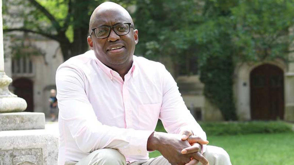 Jacob Dlamini sitting on steps on Princeton's campus.