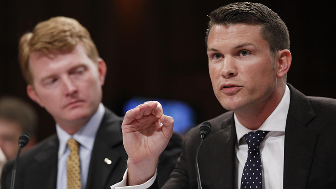 Pete Hegseth ’03, left, and another Army captain speak at a Senate Judiciary Committee hearing.