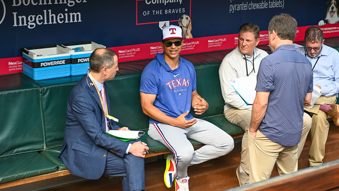 Will Venable sits in baseball dugout and speaks with reporters