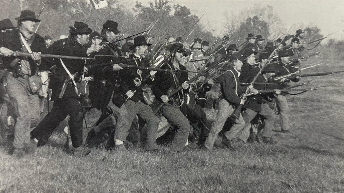 An estimated 40,000 Americans take part in reenactments of Civil War battles, like this one last October at Spring Hill, Tennessee. 