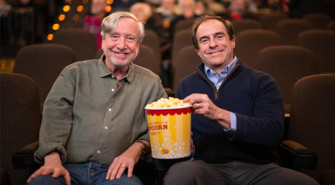 Professor Sean Wilentz and Princeton Alumni Weekly senior writer Mark. F. Bernstein ’83 sharing a tub of popcorn at the Garden Theater.