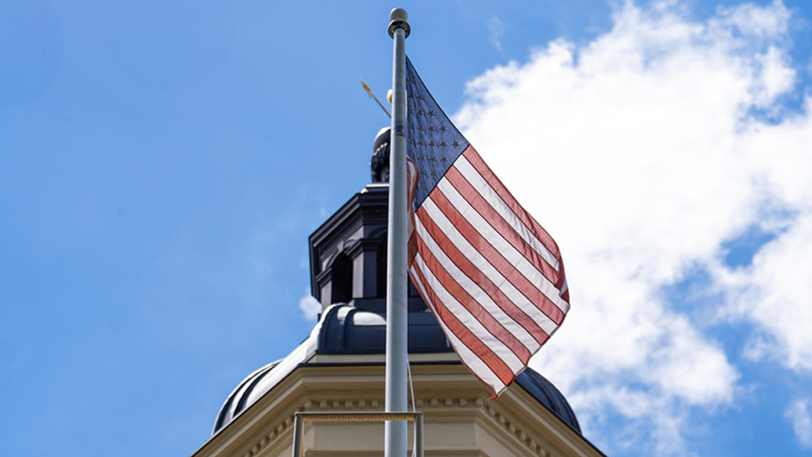 20240624_CampusBeauty_MR_ET_006-2.jpg An American flag flies in front of the cupola of Princeton’s Nassau Hall.