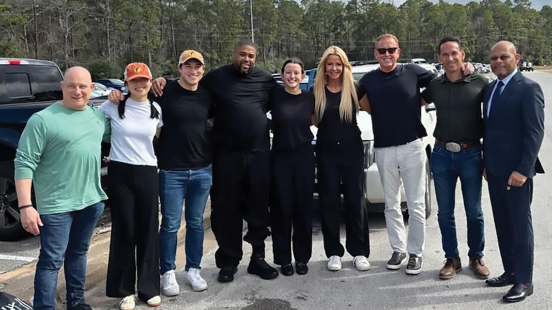 IVERY DORSEY, FOURTH FROM LEFT, GREETS THE TEAM THAT WORKED FOR HIS RELEASE