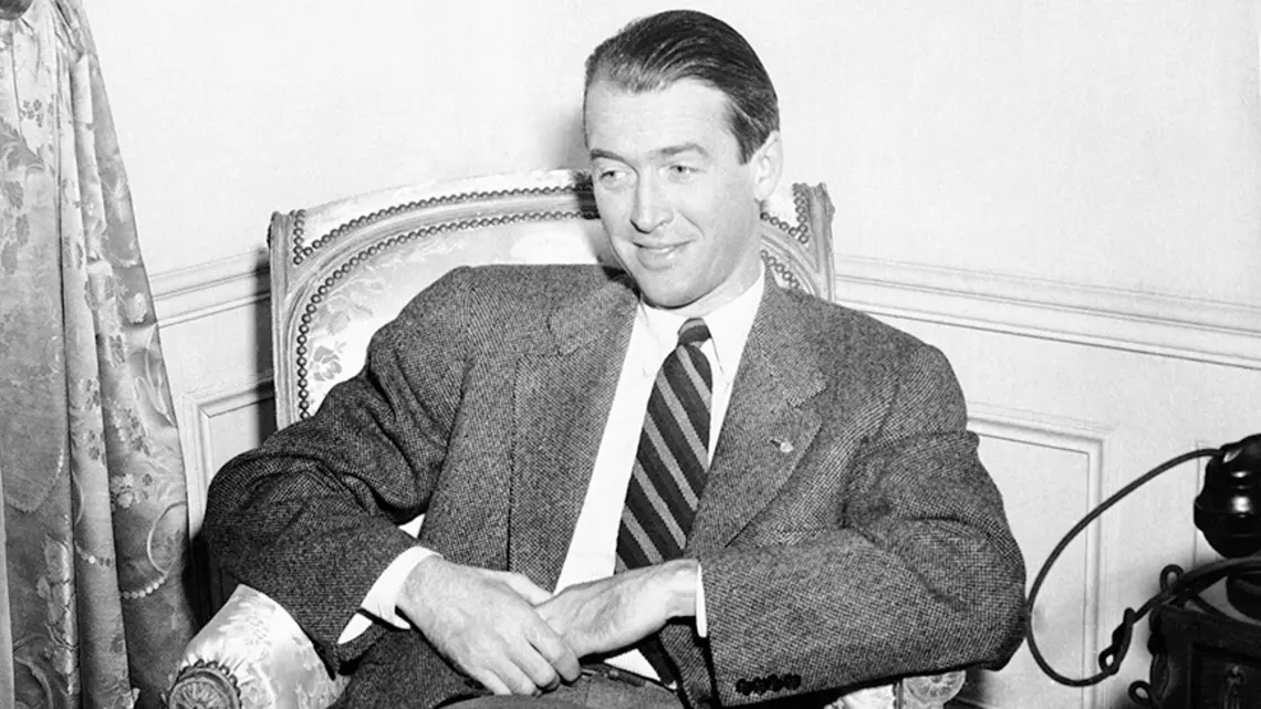 Screen star Jimmy Stewart ’32 relaxes in his suite at the Waldorf-Astoria in New York on Jan. 11, 1946. 