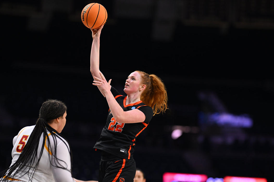 Parker Hill shoots with her right hand over defender Audi Crooks