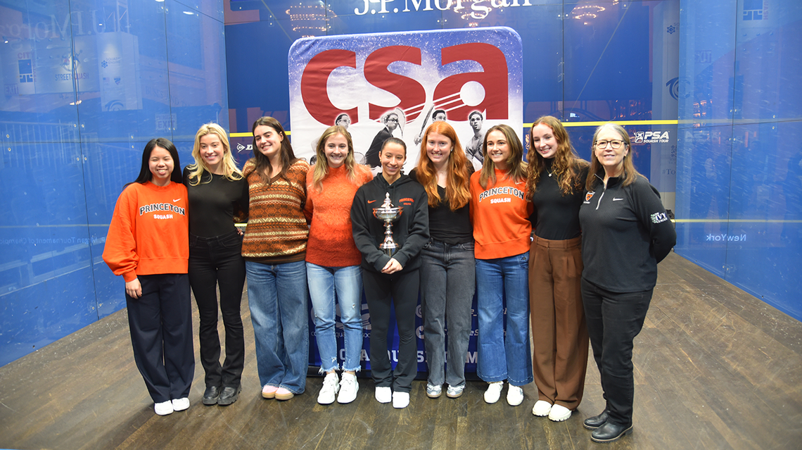Members of the Princeton women's squash team posing on a squash court in New York City