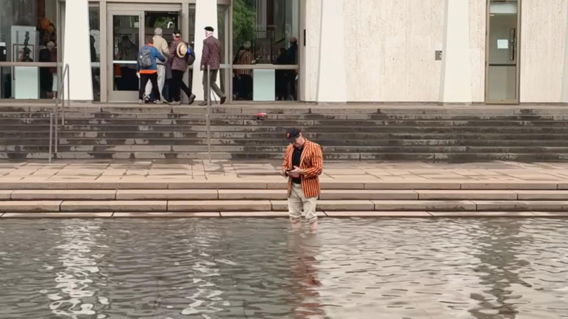 MARK VIDEO_Standing in Freedom Fountain.jpg PAW writer Mark F. Bernstein '83 stands in the reflecting pool of the Fountain of Freedom