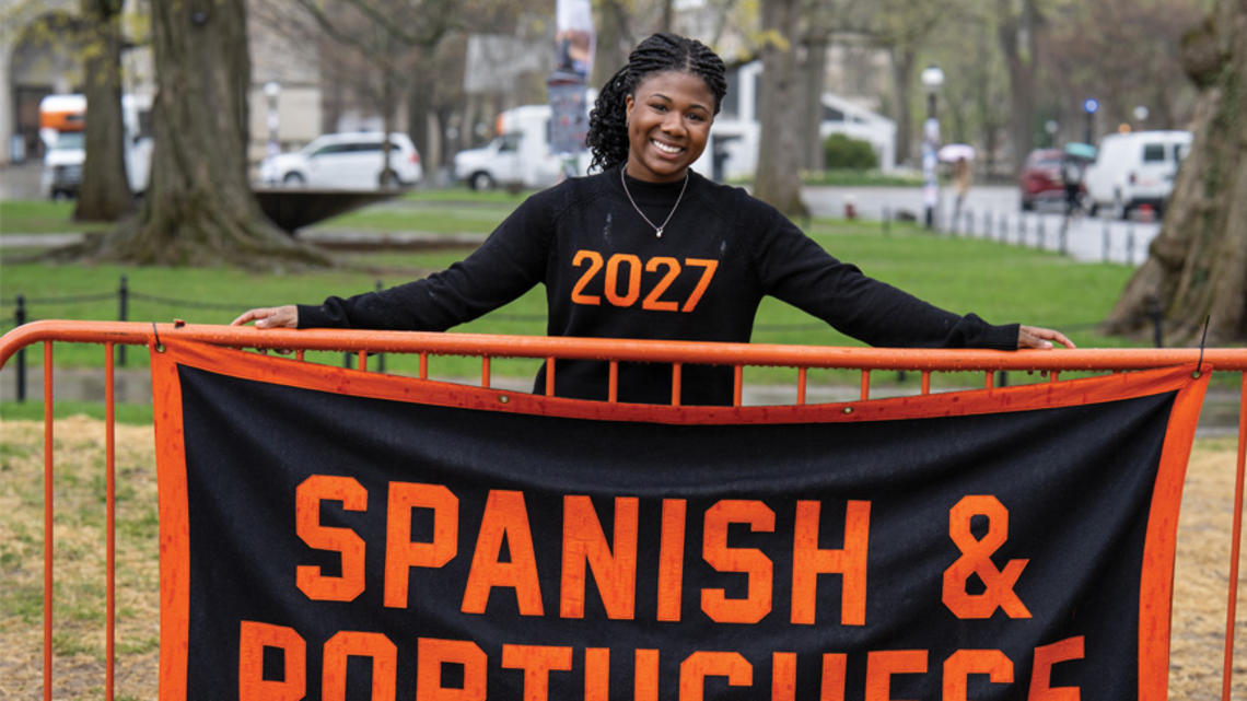 OTC_Humanities Allie Ebanks.jpg Undergrad Alli Ebanks stands behind the Spanish and Portuguese banner at Declaration Day