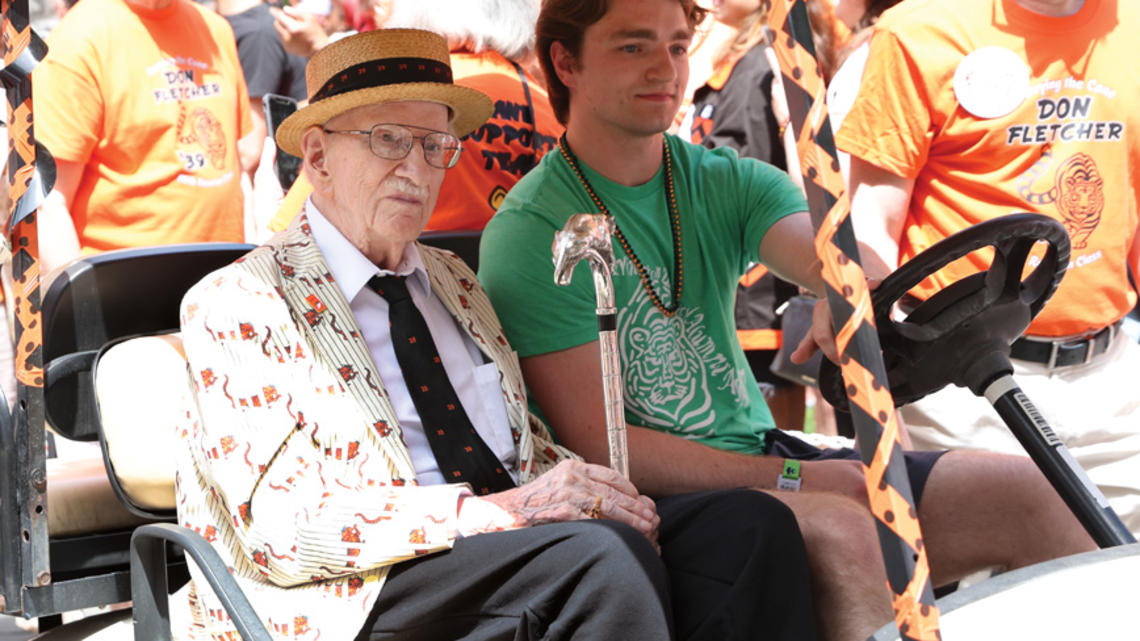 PRINCE_Don Fletcher.jpg Donald Fletcher ’39 *51 riding in a gold cart during the 2024 P-rade