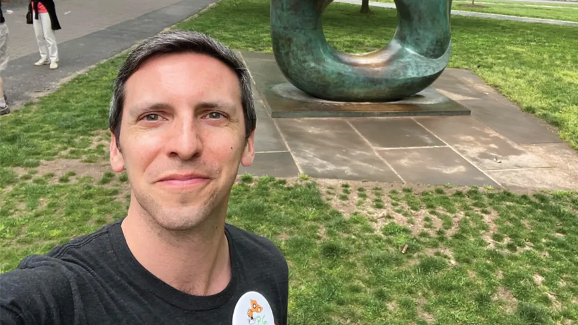 P.G. Sittenfeld ’07 takes a selfie in front of the Oval with Points sculpture at Reunions in 2022.