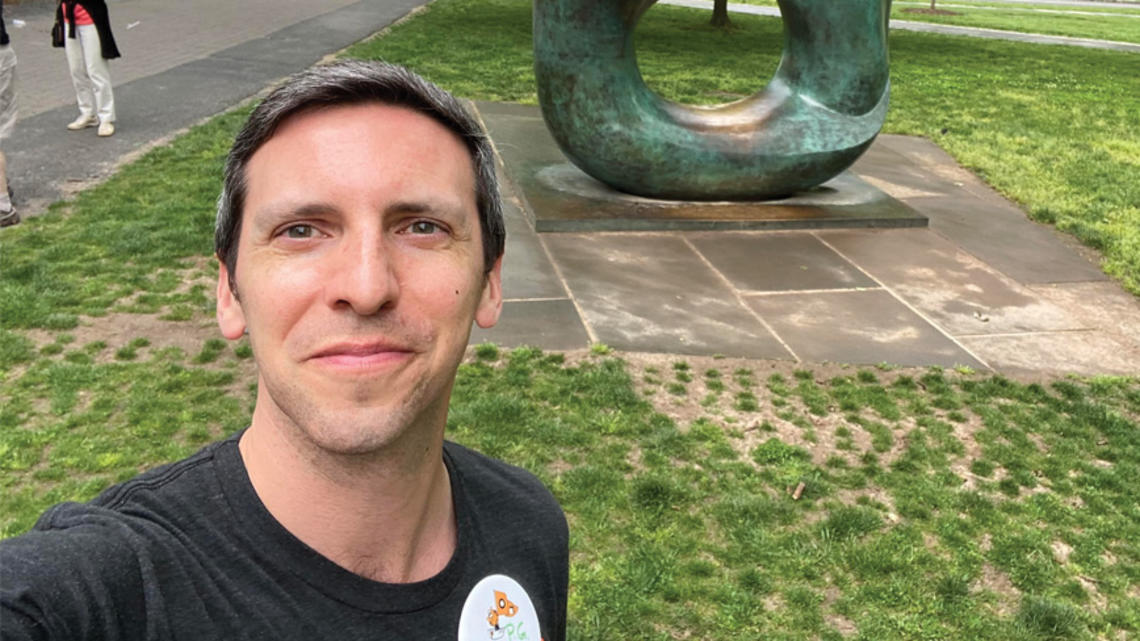 P.G. Sittenfeld ’07 takes a selfie in front of the Oval with Points sculpture at Reunions in 2022.