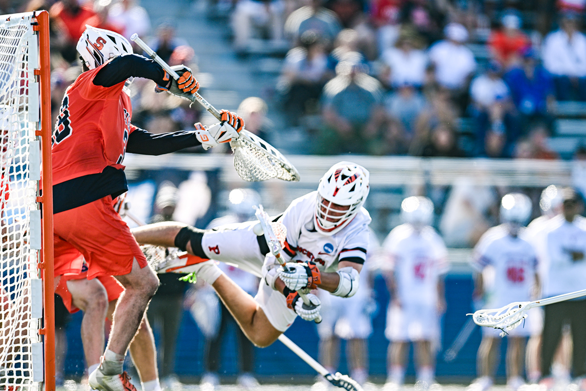 Chad Palumbo ’26 releases a diving shot against Syracuse