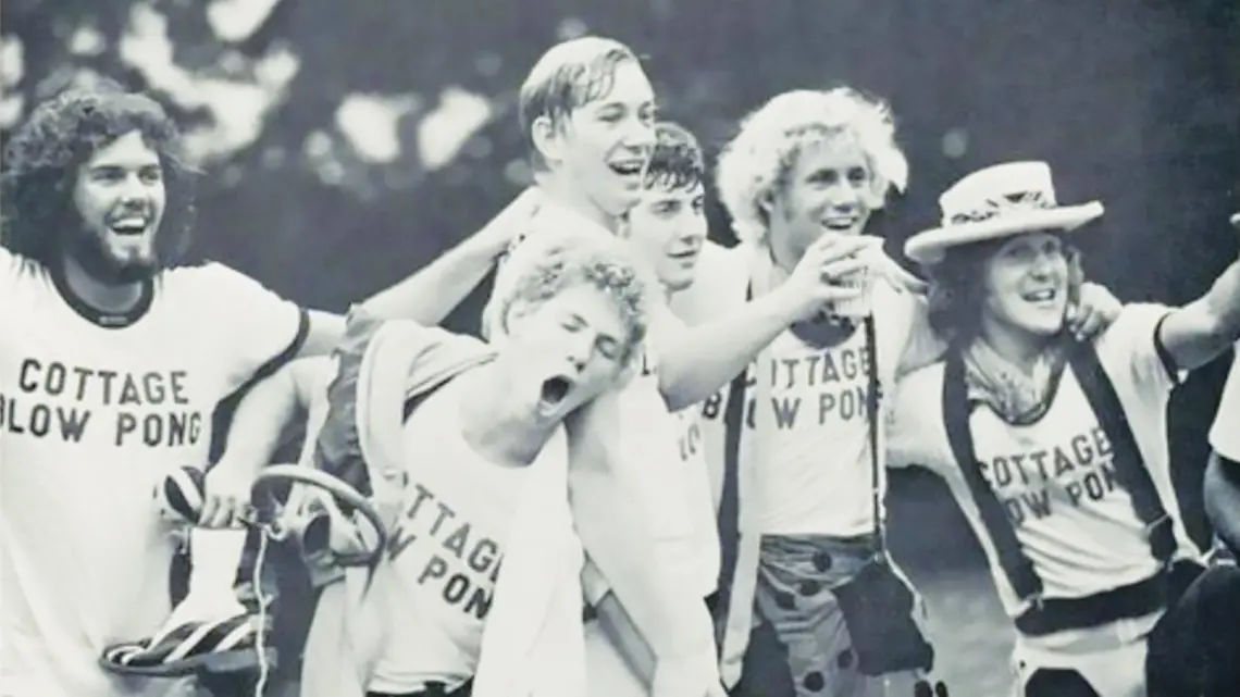 RG_Blow pong 2.jpg black and white photo of students clebrating and cheering during a blow pong tournament