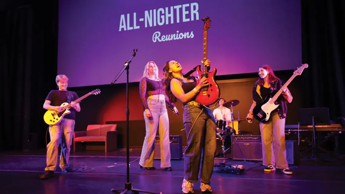 Callista Chong ’27 shreds a solo during a rendition of “Sweet Child ’o Mine,” as performed by Casual Riot. Other members include, from left, guitarist Rohan Sykora ’27, lead singer Nina Weeldreyer ’26, drummer Garrett McKenzie ’28, and bassist Sam Berk ’28.