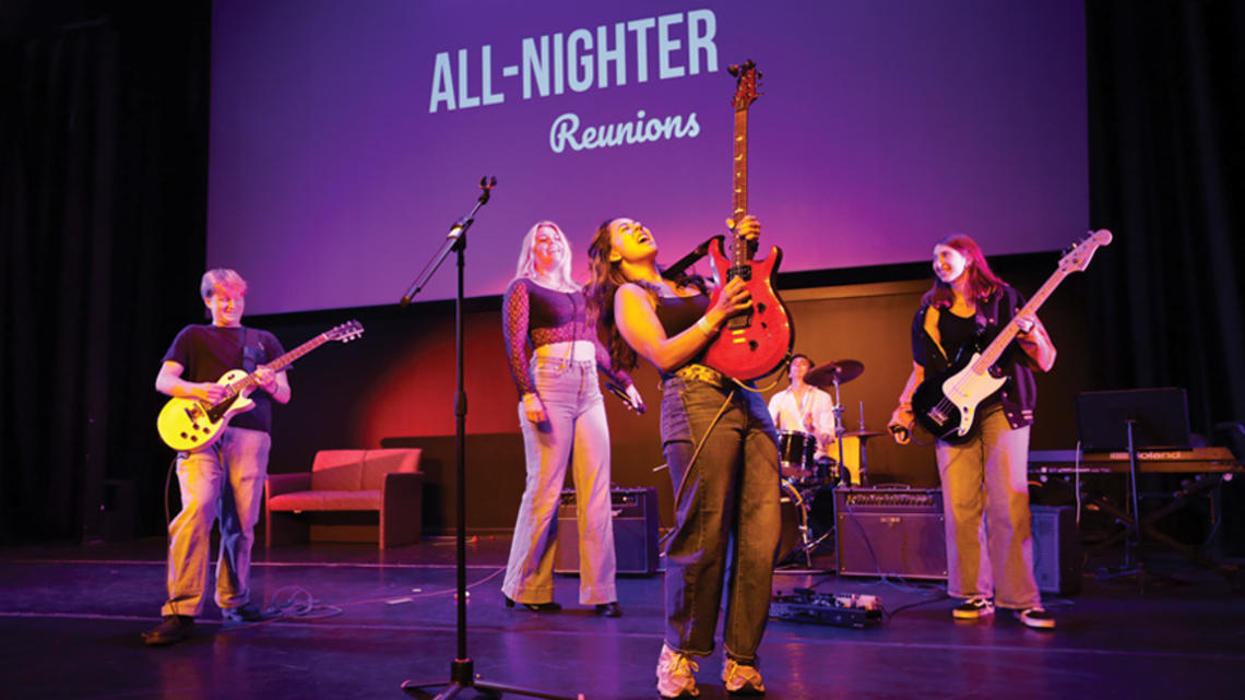Callista Chong ’27 shreds a solo during a rendition of “Sweet Child ’o Mine,” as performed by Casual Riot. Other members include, from left, guitarist Rohan Sykora ’27, lead singer Nina Weeldreyer ’26, drummer Garrett McKenzie ’28, and bassist Sam Berk ’28.