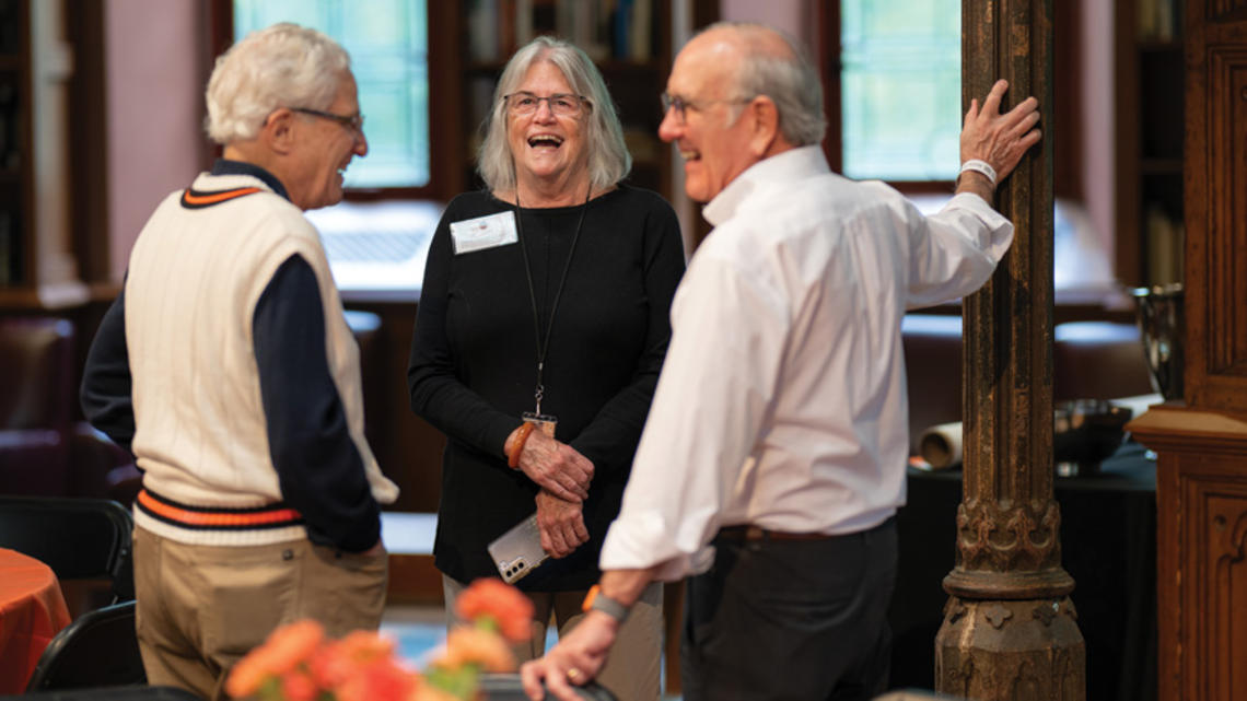 Dottie Werner speaking with two members of the Old Guard