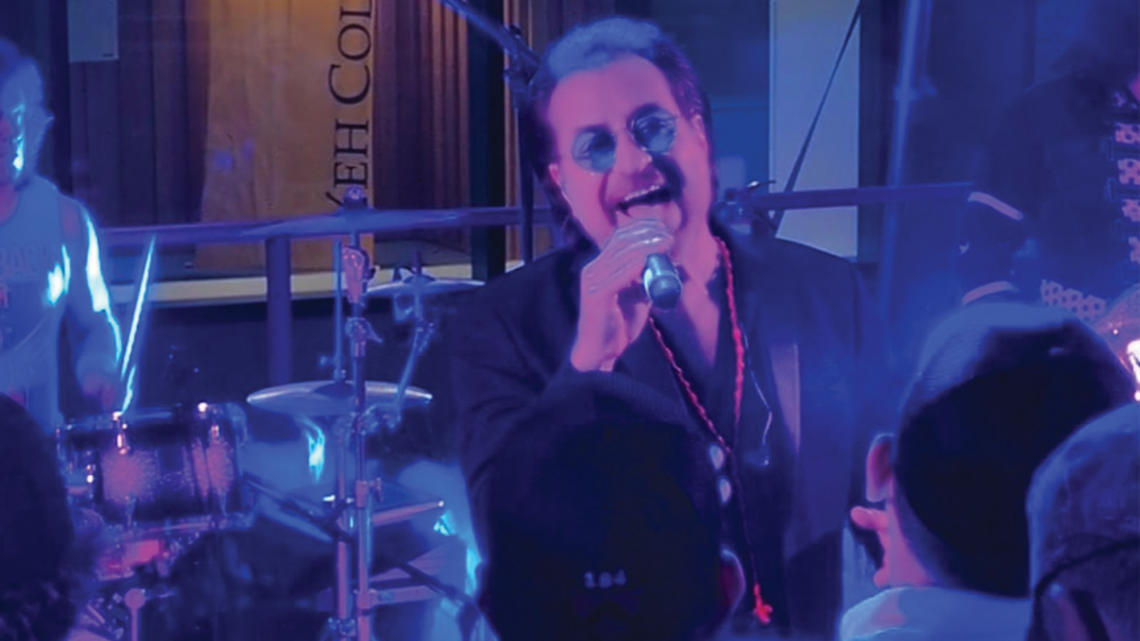 Anthony Russo performing as Bono from U2