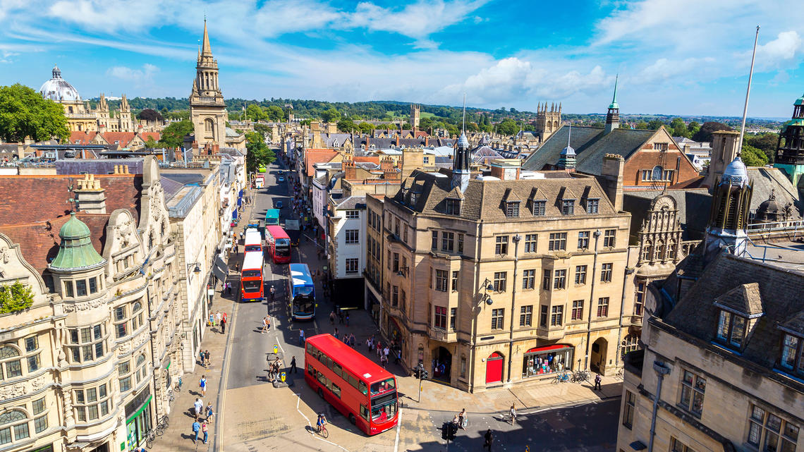 TigerTravels_Oxford1.jpg A birds-eye view of Oxford's quaint streets, with a red double-decker bus driving down the middle.