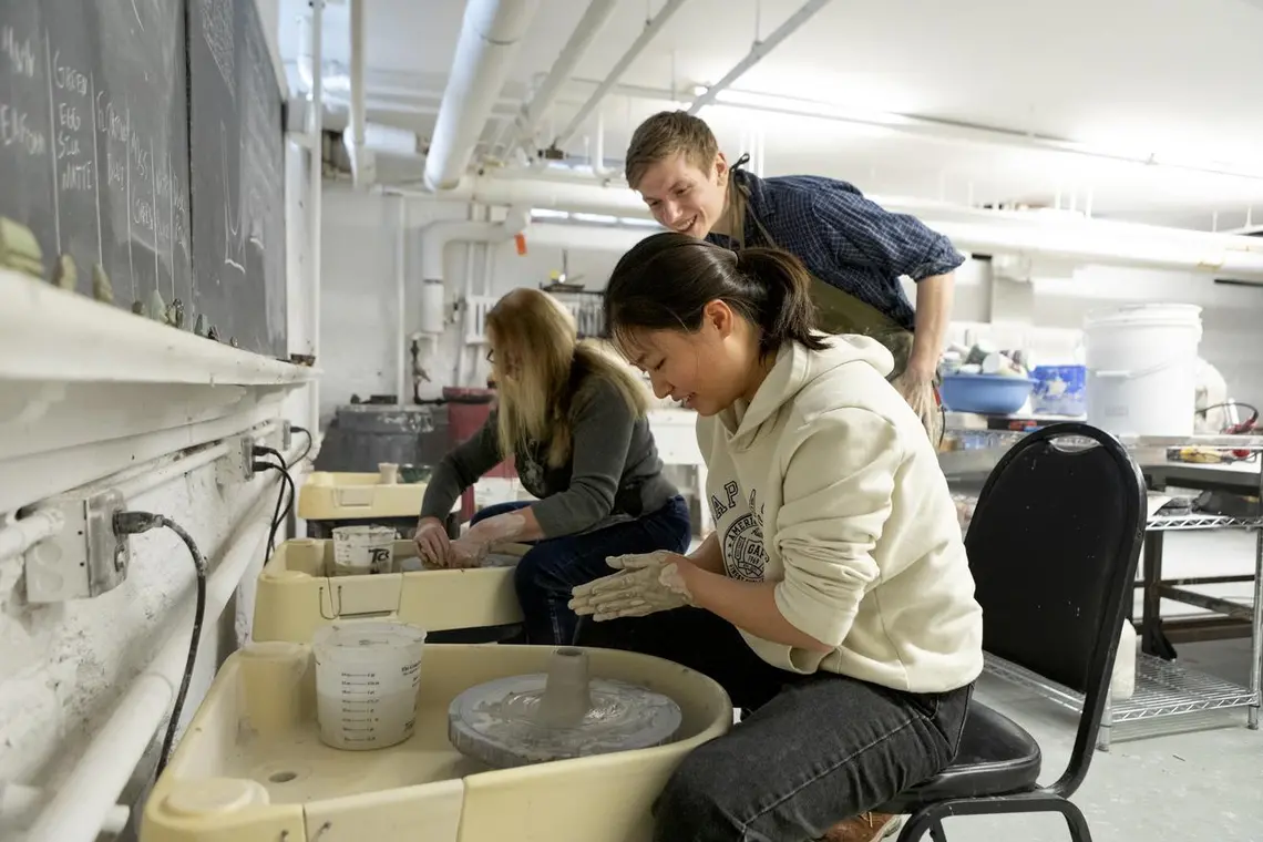 20240118_Wintersession_Pottery_DJA_121.jpg Students and instructor at pottery wheels
