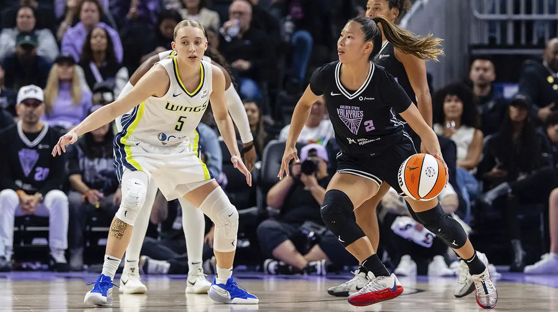Kaitlyn Chen dribbles against former UConn teammate Paige Bueckers