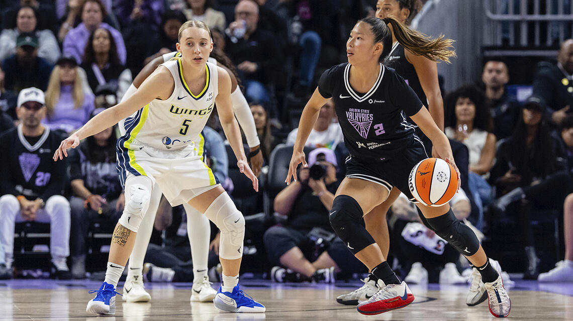 Kaitlyn Chen dribbles against former UConn teammate Paige Bueckers