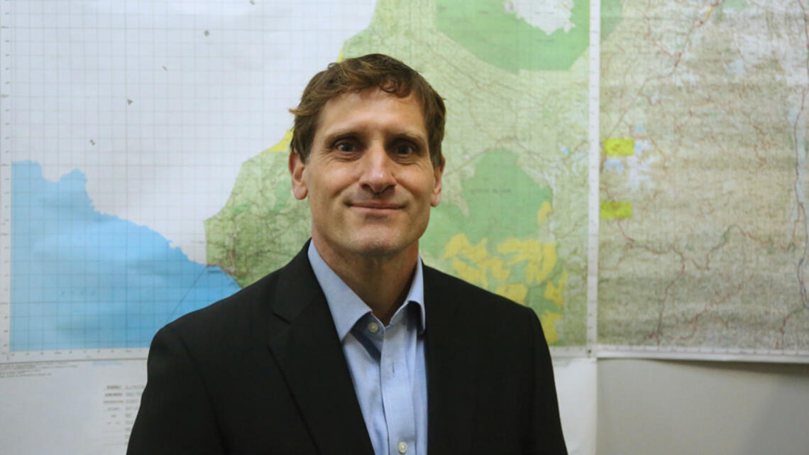 PRINCE_Rupert Elderkin *14.jpg Rupert Elderkin *14 standing in front of a wall of maps