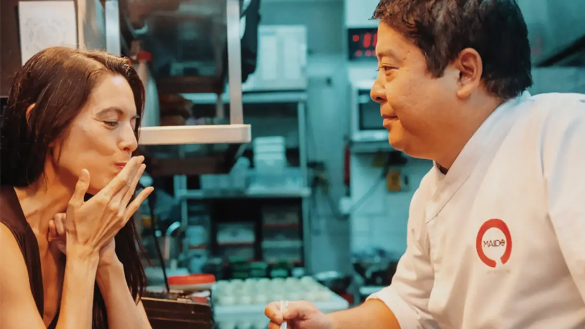 Ligaya Mishan ’91 in the kitchen with Mitsuharu “Micha” Tsumura, the chef and owner of Maido in Lima, Peru, which was named The World’s Best Restaurant for 2025 by Restaurant, a small industry magazine in England that first started the influential list in 2002