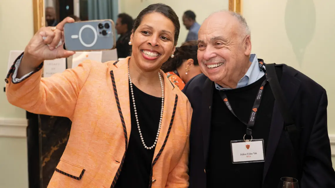 MANY MINDS_Julius Coles.jpg Karen Jackson-Weaver ’94 takes a selfie with Julius Coles *66 during a reception at Prospect House.