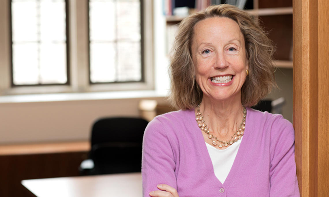 Anne Case, photographed in front of an empty office.