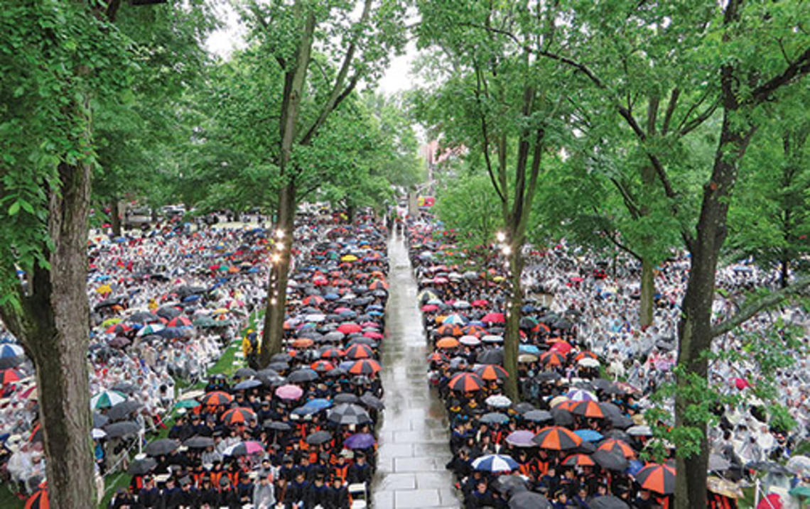 The front campus was filled with umbrellas and ponchos in this view of Commencement from Nassau Hall.