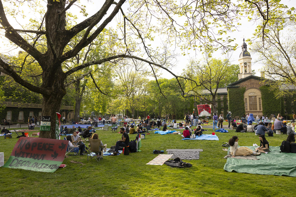 Pro-Palestinian protesters at their encampment on Cannon Green.