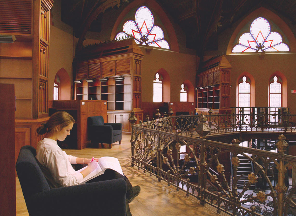 Woman studying in the Chancellor Green Rotunda