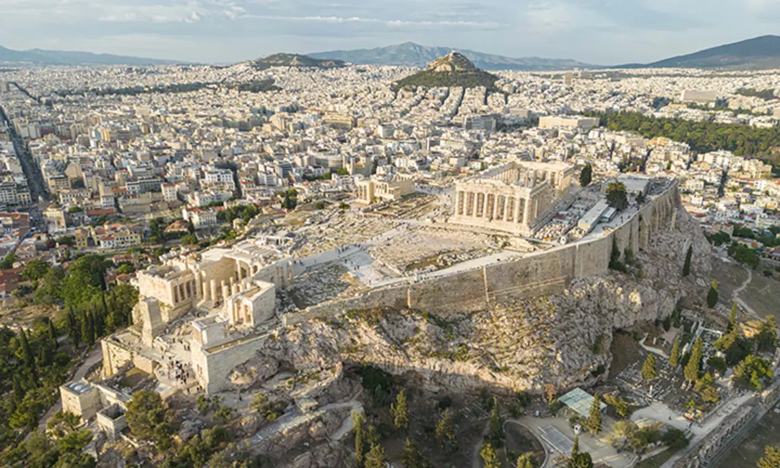 Aerial panoramic view from a drone of the Acropolis of Athens, a rocky outcrop above the city of Athens with many remains of several ancient buildings, the most famous of them is the Parthenon Temple a citadel with Classical architecture.
