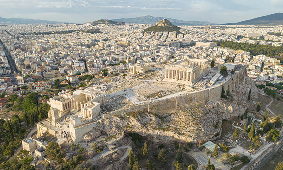 GlobalSeminars.jpg Aerial panoramic view from a drone of the Acropolis of Athens, a rocky outcrop above the city of Athens with many remains of several ancient buildings, the most famous of them is the Parthenon Temple a citadel with Classical architecture.