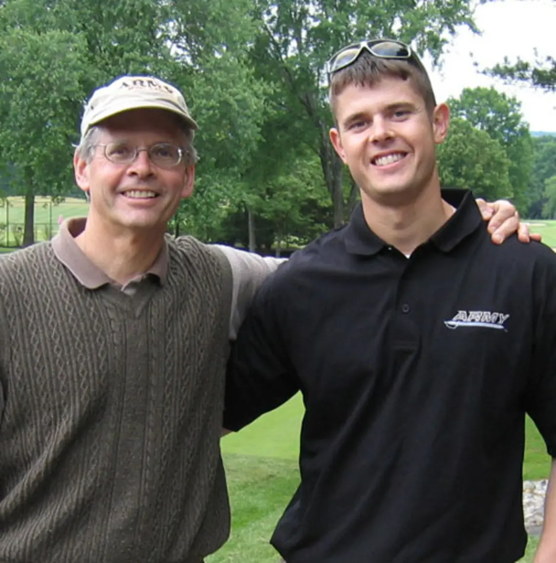 IMG_1632.jpg Mark Larsen '76, left, with his son, Christopher.