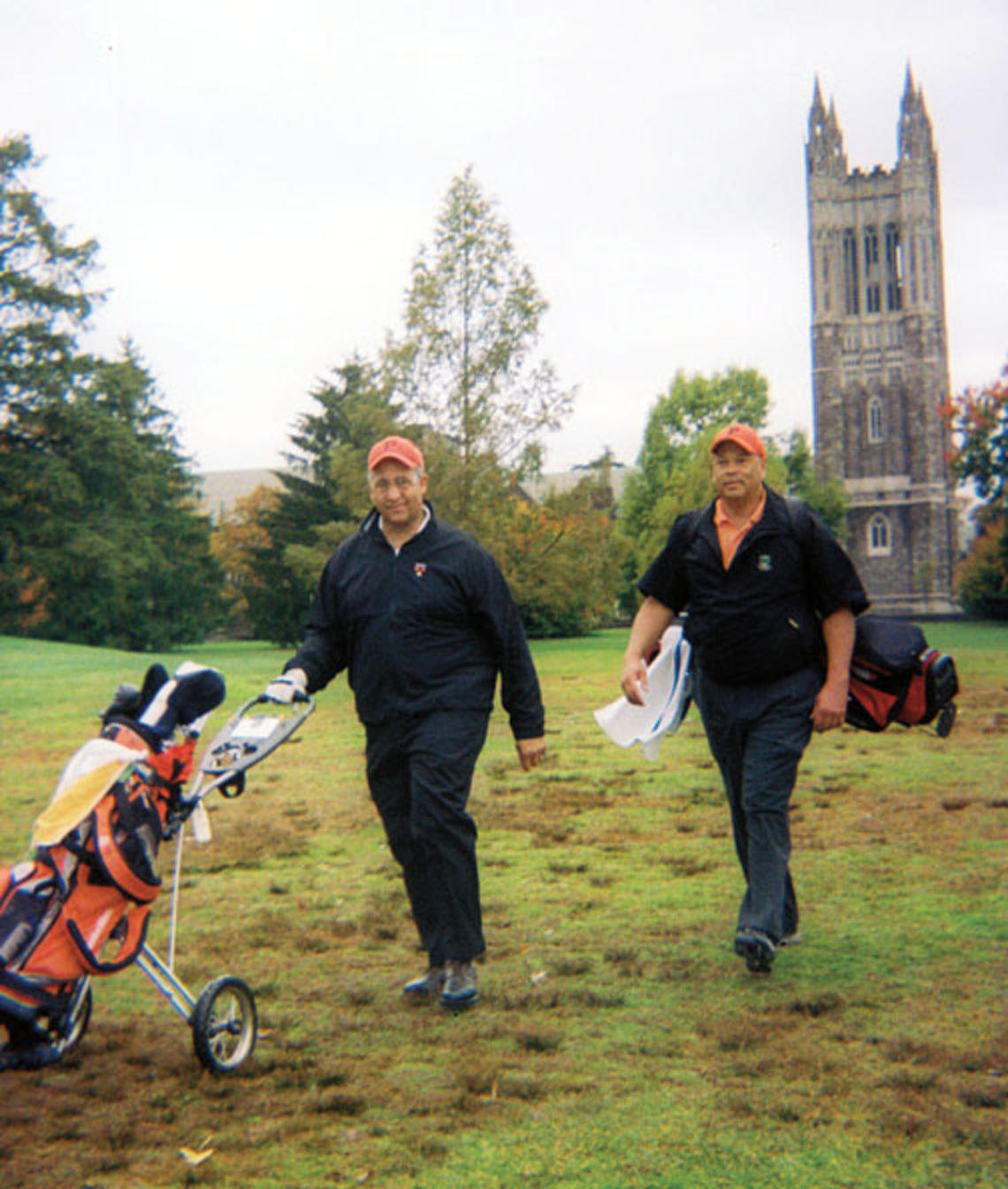 Burton Smith ’77, left, and Rick Hyde ’75, who broke the Ivy League’s color barrier in golf, returned to Springdale last fall.