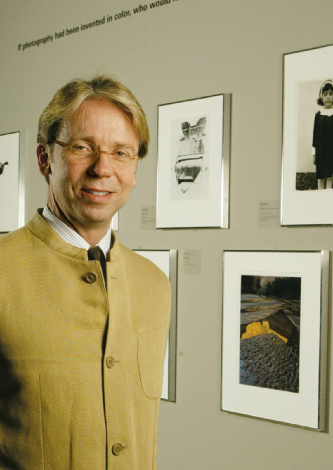 James Steward, director of the University Art Museum, in a gallery exhibiting photos from a summer exhibition, “Starburst: Color Photography in America 1970­–1980.”