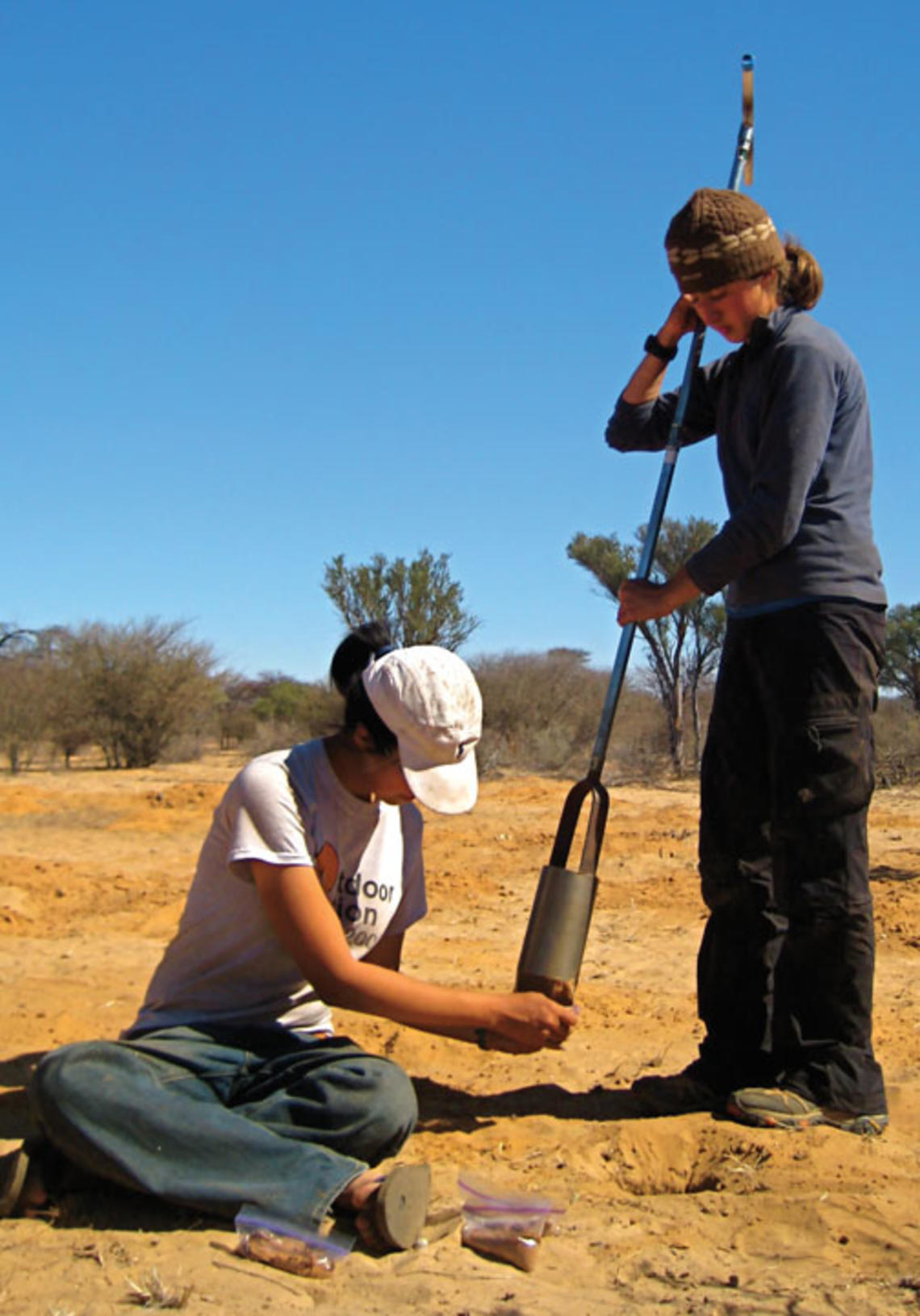  Supported by Grand Challenges funding, Ming Lu ’12, left, and Molly O’Connor ’11 collect soil samples for laboratory analysis in Botswana. 