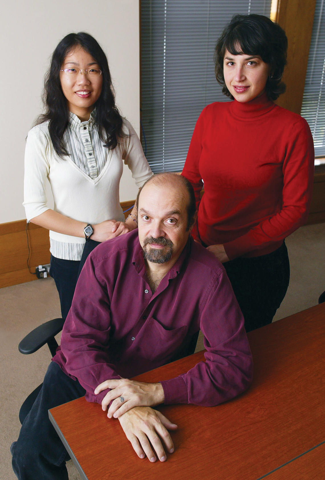 Working on the Aphasia Project are Professor Perry Cook and graduate students Xiaojuan Ma, left, and Sonya Nikolova.