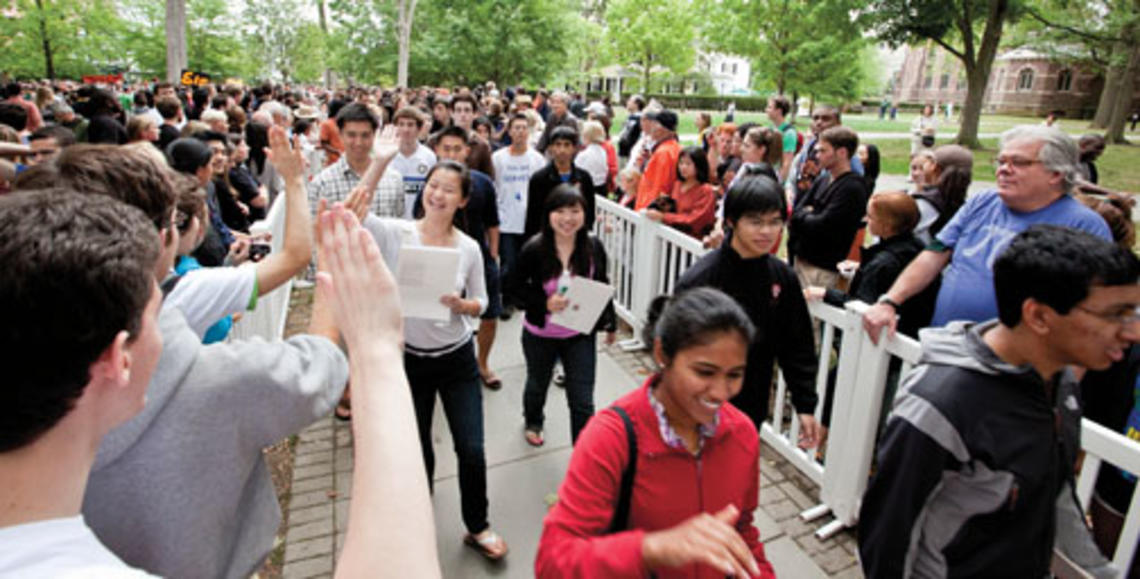  Freshmen receive high-fives as they are greeted in the Pre-rade following Opening Exercises.