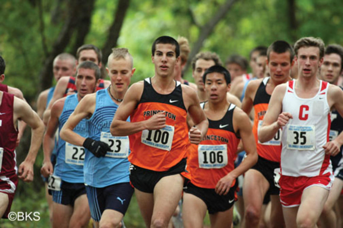 LIVE.SP_HepsMen.jpg Donn Cabral ’12, center, won the men’s race with the second-fastest time in Heps history.