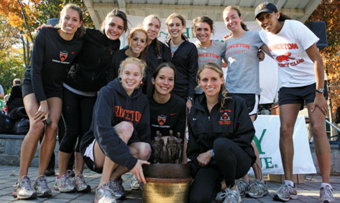 The women’s cross country team celebrates its 2009 Ivy Championship, the fourth for its seniors, in front row, from left, Reilly Kiernan, Alexa Glencer, and Liz Costello.