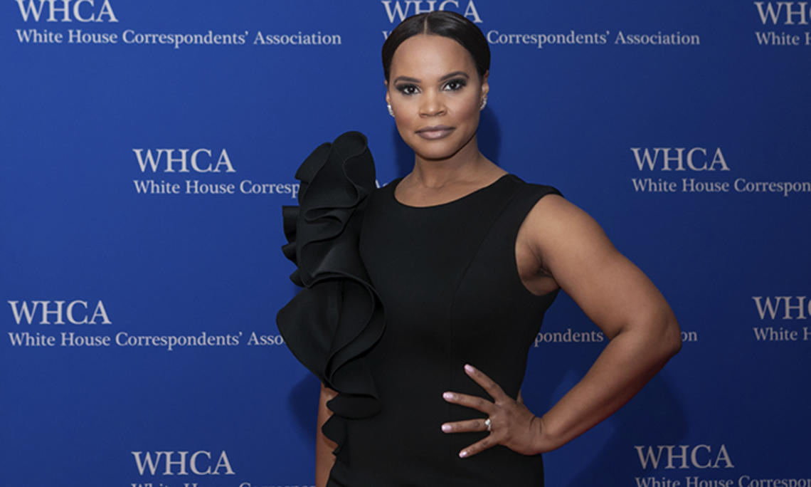 Laura Coates ’01 is photographed against a backdrop that reads "White House Correspondents’ Association."