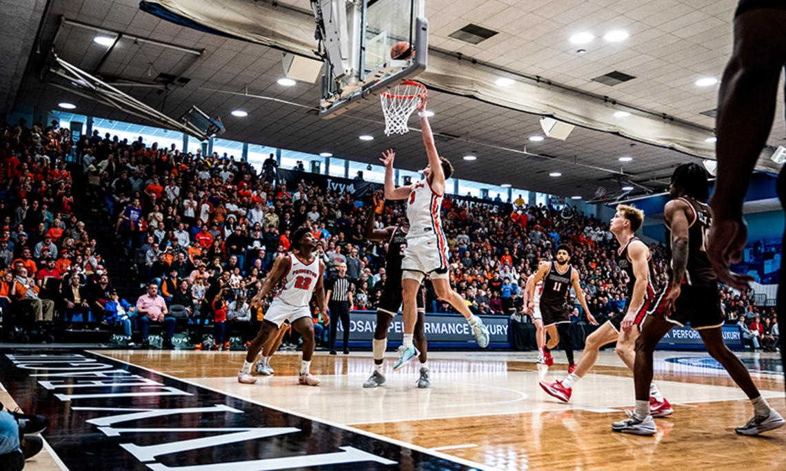 Caden Pierce ’26 lays in a basket against Brown