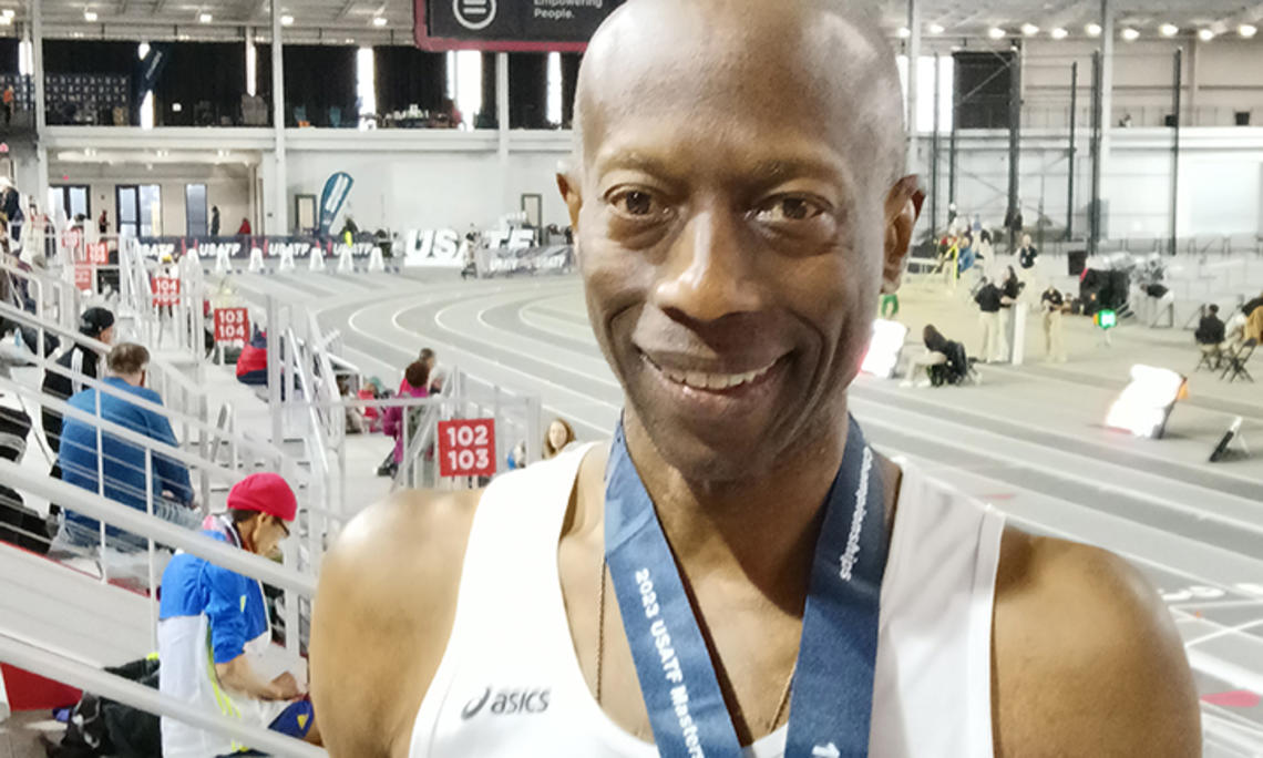 Bruce McBarnette in front of an indoor track