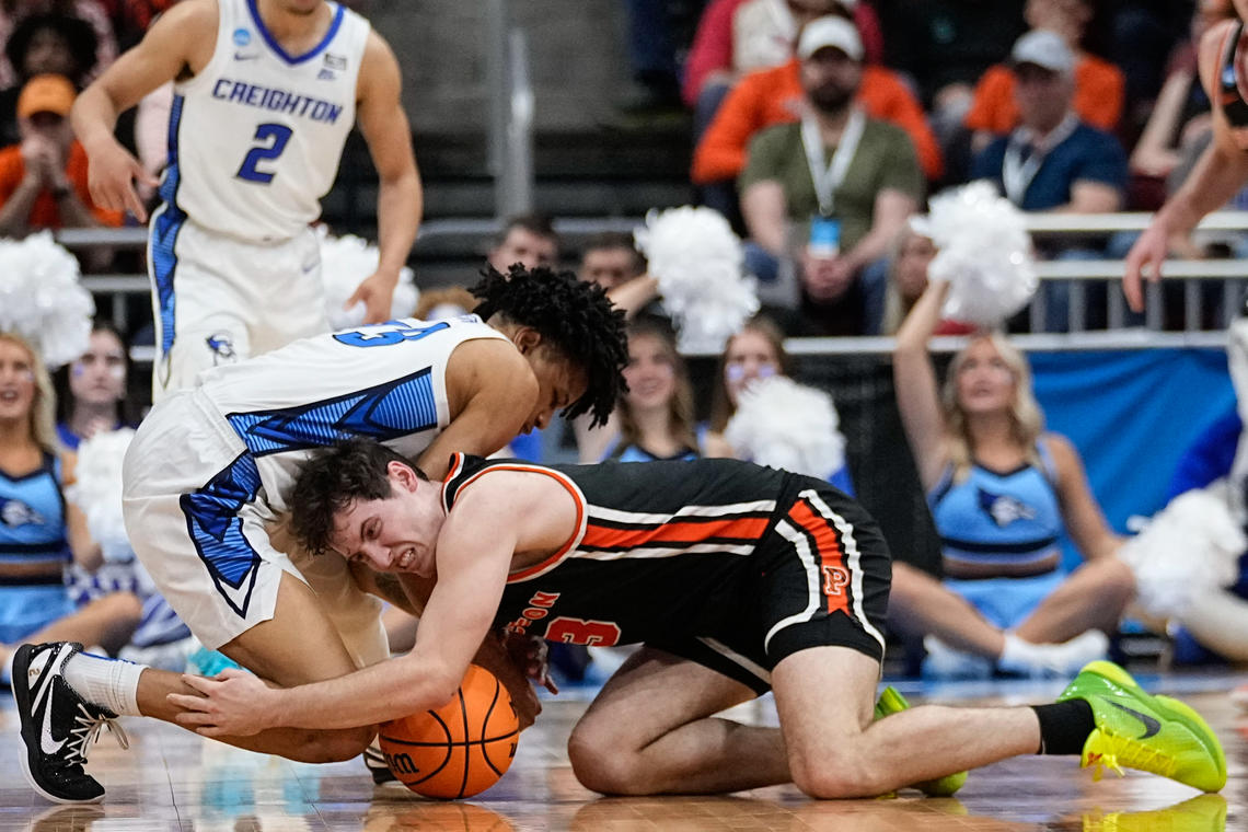 Creighton's Trey Alexander and Princeton's Ryan Langborg ’23 vie for a loose ball in the second half of Friday's Sweet 16 game.