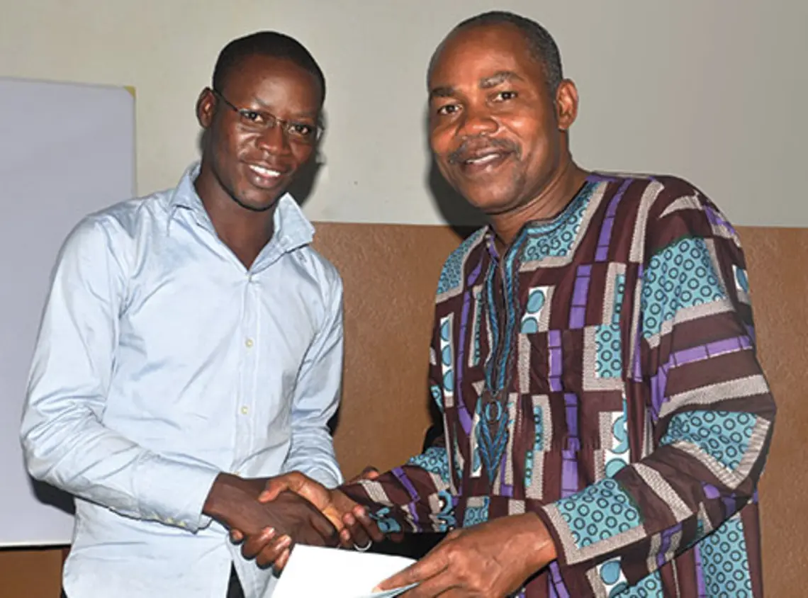 Mind-Wantchekon1.jpg Leonard Wantchekon, right, congratulates Romaric Samson on earning a master’s degree from the institute in Benin, West Africa, that Wantchekon founded.