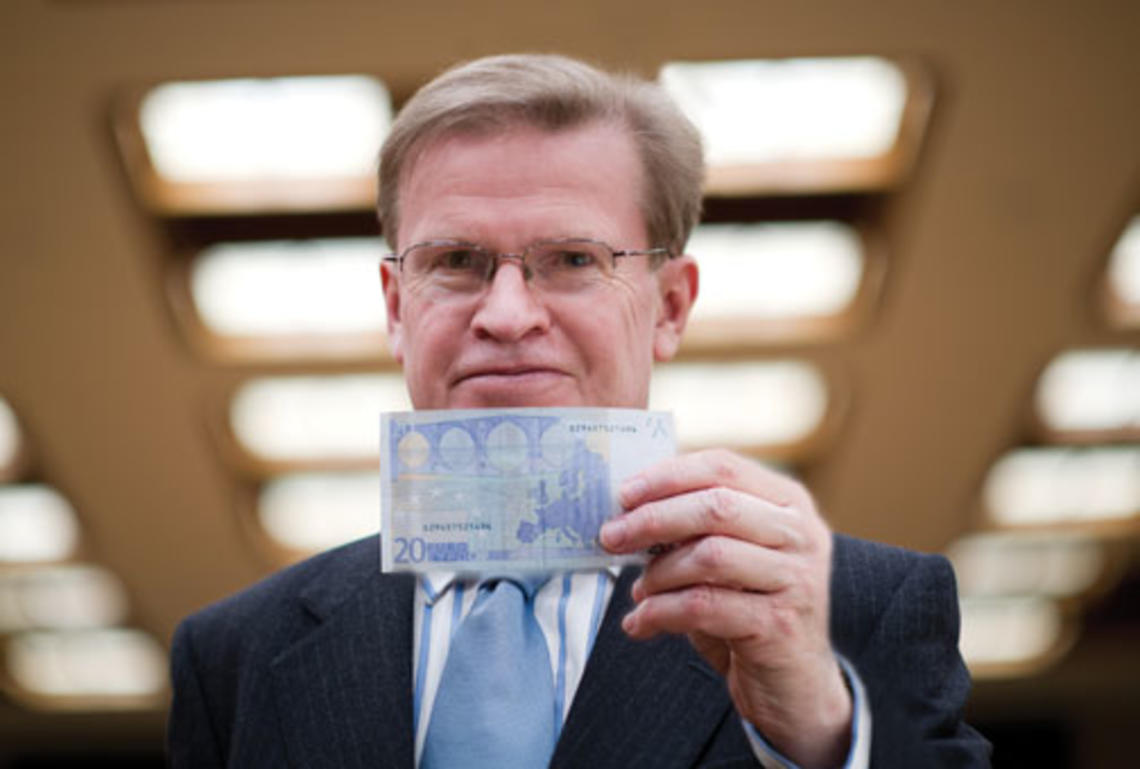 A new book by ­Professor Harold James, shown holding a 20-euro note, finds “a crucial flaw” in the creation of the European Monetary Union.