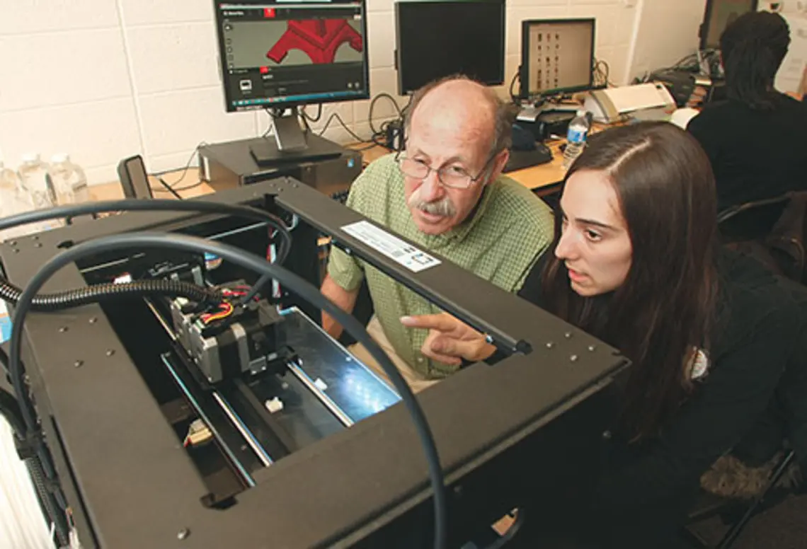 OTC-3Dprinting5216new.jpg Professor Michael Littman and Cara de Freitas Bart ’15 review the results of a 3-D printing test.